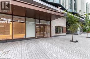 Toronto condo for rent - A realtor office is located on the corner of a street.