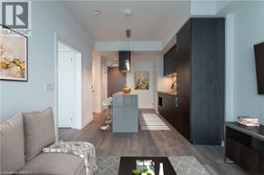 Toronto condo for rent - A modern living room with a grey sofa and a coffee table.