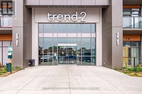 Hamilton (Waterdown) condo for rent - The entrance to a building with the name "trend2" on it.