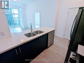Hamilton (Waterdown) condo for rent - A kitchen with a sink and cabinets.