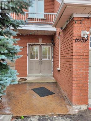 Mississauga (Meadowvale Village) apartment for rent - A brick house with the number 6959 on it.