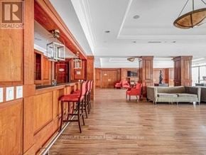 Toronto (West Humber-Clairville) condo for rent - A well-lit living room with wooden floors and furniture.