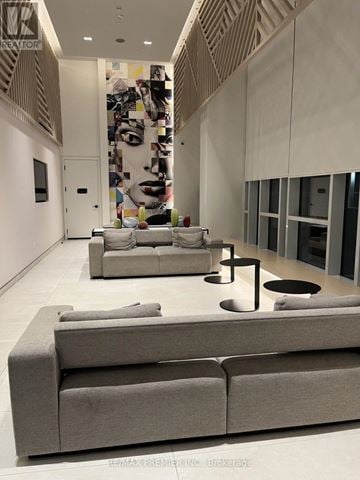 Toronto (Islington-City Centre West) condo for rent - A modern living room with a grey sofa and a coffee table.