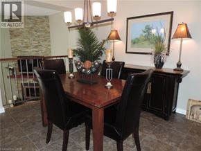Burlington townhouse for rent - A dining room with a wooden table and chairs.