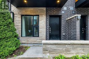 Brampton (Fletcher's Creek South) townhouse for rent - A house with a black door and a glass window.