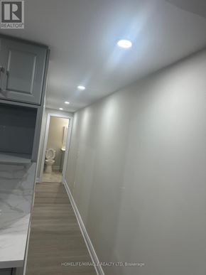 Brampton (Credit Valley) apartment for rent - A long hallway with a toilet visible in the distance.