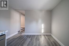 Windsor apartment for rent - A room with wooden flooring and a window letting in light.