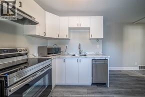 Windsor apartment for rent - A kitchen with white cabinets and stainless steel appliances.