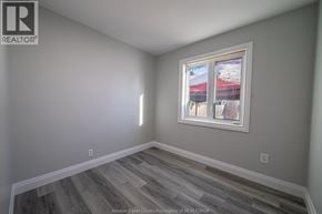 Windsor apartment for rent - A room with a window showing a snowy landscape outside.