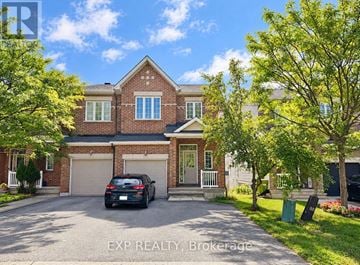 Ottawa townhouse for rent - A house with a car parked in front of it.