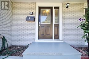Ottawa apartment for rent - A house with a brown door and a sign that says "REALTOR".