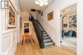 Collingwood apartment for rent - A hallway with a staircase and a rug on the floor.