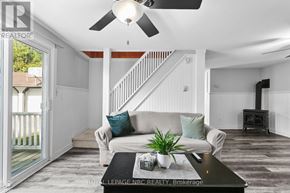 Fort Erie (Crystal Beach) apartment for rent - A living room with a couch, a coffee table, and a ceiling fan.