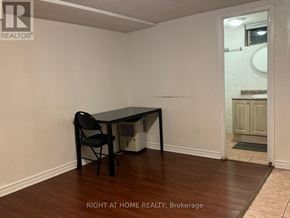 Richmond Hill (Crosby) apartment for rent - A room with a desk and chair in it.