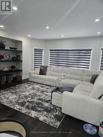 Milton (Campbellville) apartment for rent - A living room with a white couch and a grey rug.
