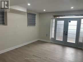 Brampton (Credit Valley) apartment for rent - A room with a sliding glass door and wooden flooring.
