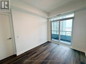 Vaughan (Vaughan Corporate Centre) condo for rent - A room with a sliding glass door leading to a balcony.