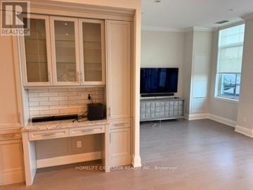 Markham (Unionville) condo for rent - A kitchen with a countertop and cabinets with a window.