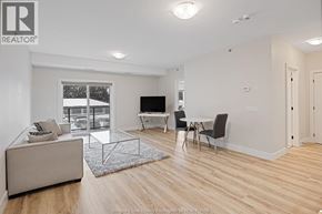 Kingsville condo for rent - A living room with a couch, chairs, and a television.