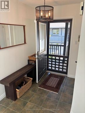 Collingwood townhouse for rent - A hallway with a bench and a mirror.