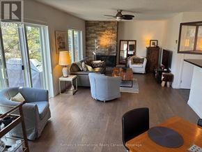 Collingwood townhouse for rent - A living room with a fireplace and a couch.