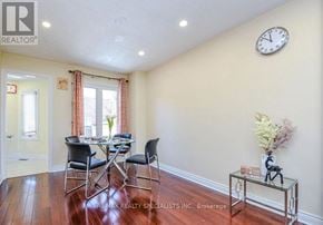Mississauga (Lisgar) apartment for rent - A dining room with a glass table and chairs.
