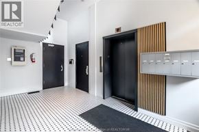 Chatham apartment for rent - A hallway with black doors and a white wall.