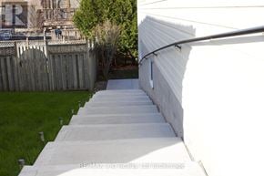 Woodstock (Woodstock - South) apartment for rent - A set of white concrete stairs lead up to a building.