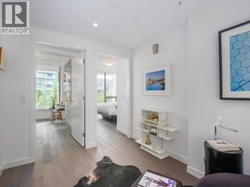 Vancouver townhouse for rent - A living room with a cowhide rug and a framed picture on the wall.