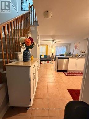 Brampton (Fletcher's Meadow) apartment for rent - A kitchen with a staircase on the left side.
