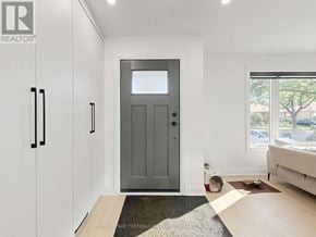 Toronto (Clanton Park) apartment for rent - A modern interior with a grey door and white walls.