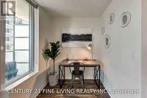 Toronto (Niagara) condo for rent - A room with a desk and a chair in front of a window.