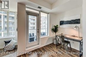 Toronto (Niagara) condo for rent - A room with a desk and a chair in front of a window.