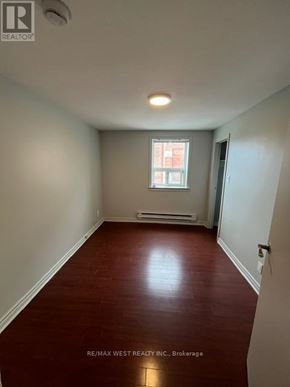 Toronto (Trinity-Bellwoods) apartment for rent - A room with a window and a door.