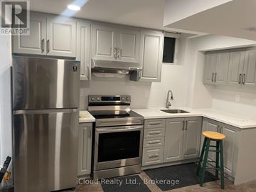 Mississauga (Churchill Meadows) apartment for rent - A kitchen with a stainless steel refrigerator and a stove top oven.