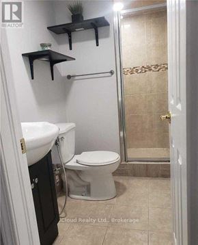 Mississauga (Churchill Meadows) apartment for rent - A bathroom with a toilet, sink, and shower.