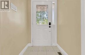 Brampton (Madoc) apartment for rent - A white door with a glass window in the middle of a room.