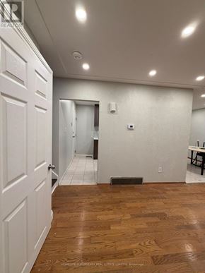Waterloo apartment for rent - A room with a wooden floor and white walls.