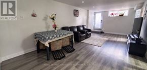 Brampton (Westgate) apartment for rent - A living room with a couch, chair, and a coffee table.