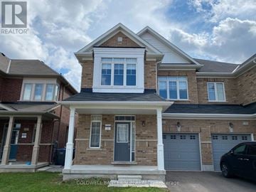 Brampton (Northwest Brampton) apartment for rent - A house with a realtor logo in the corner.