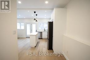 Toronto (Palmerston-Little Italy) apartment for rent - A well-lit kitchen with a dining area in a house.