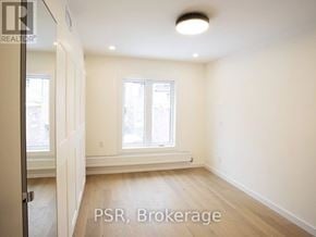 Toronto (Palmerston-Little Italy) apartment for rent - A room with a window and a radiator on the wall.