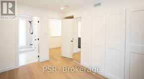 Toronto (Palmerston-Little Italy) apartment for rent - A realtor's office with white walls and wooden floors.
