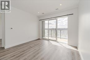 Cambridge condo for rent - A spacious room with a large window and sliding glass doors.