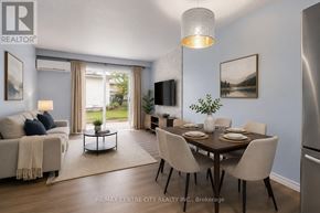 London East (East A) townhouse for rent - A modern dining room with a glass table and chairs.