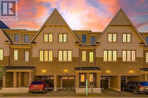 Oshawa (Windfields) townhouse for rent - A row of houses with the logo REALTOR on the top left.