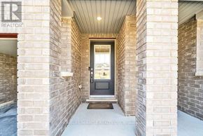Oshawa (Windfields) townhouse for rent - A doorway with a black door and a doormat in front.