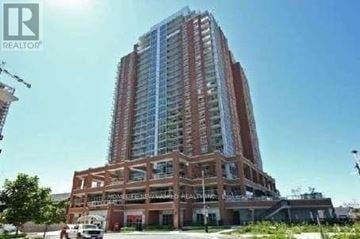 Toronto (Niagara) condo for rent - A tall building with a glass facade is under construction.