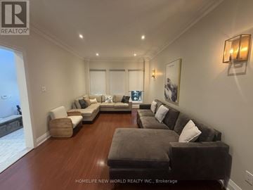 Richmond Hill (South Richvale) apartment for rent - A living room with a grey couch and a brown ottoman.