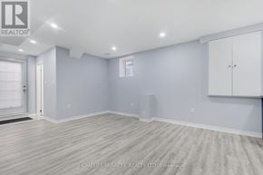 Brampton (Northwest Brampton) apartment for rent - A spacious room with light grey walls and wooden flooring.